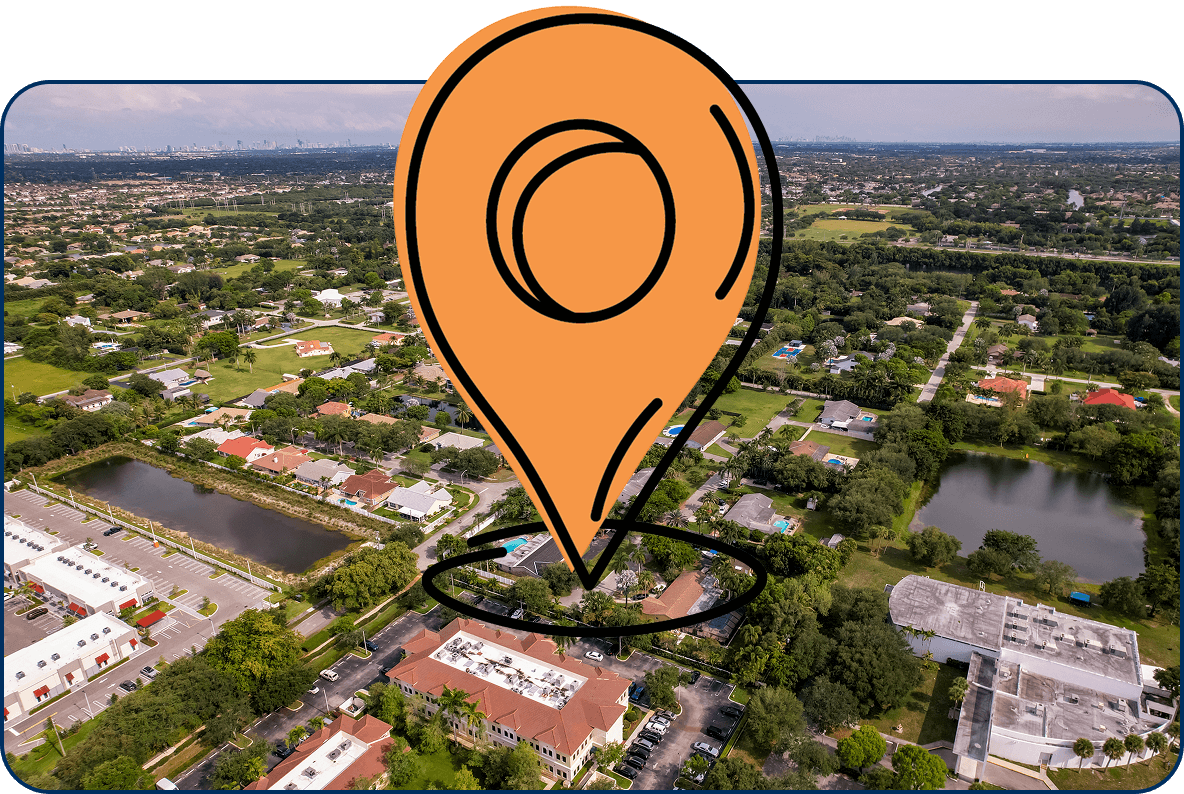 Large location pin icon on aerial view of Cooper City, Florida with homes, lakes, and tree-lined streets under a clear sky
