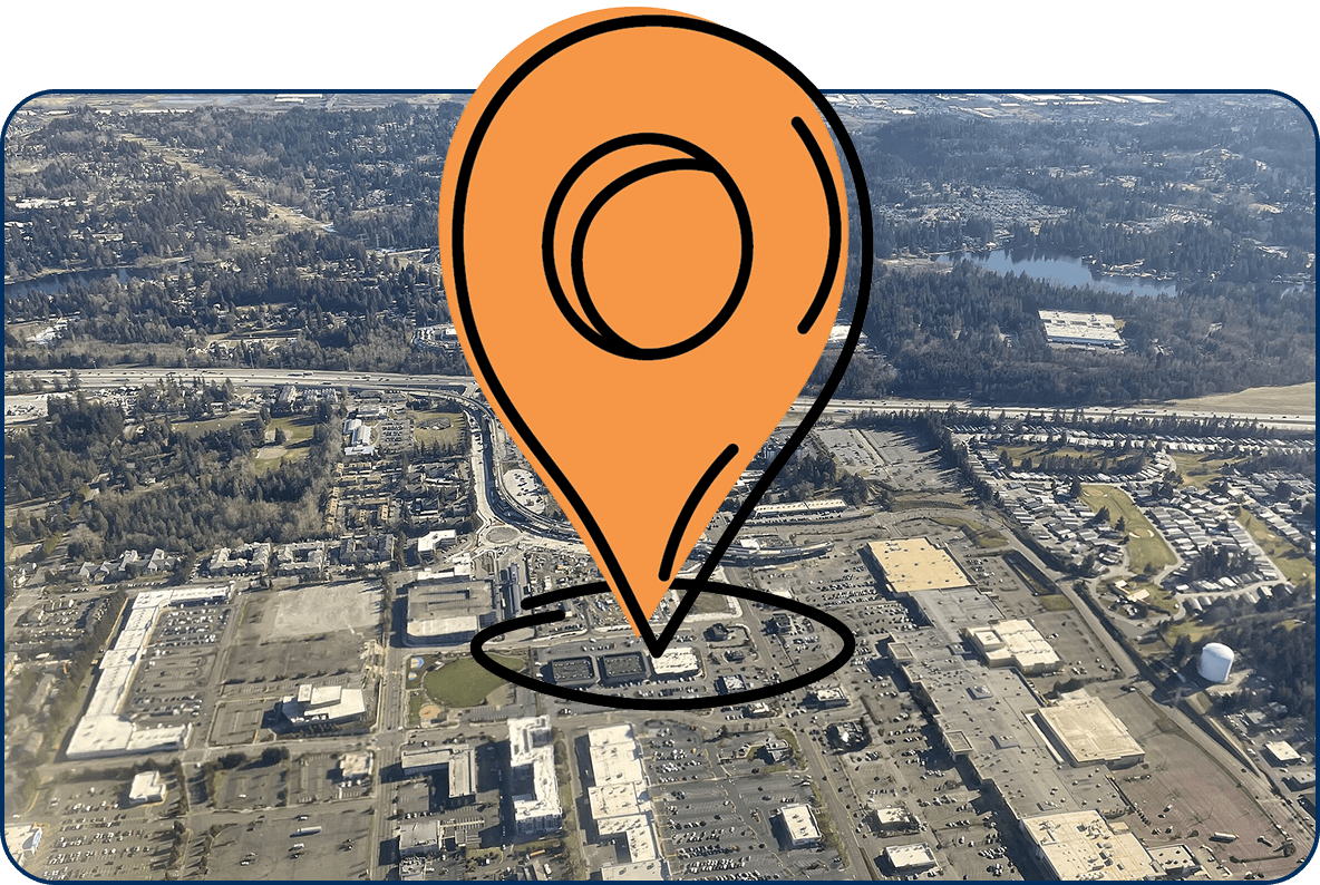 Large location pin icon on aerial view of Federal Way, Washington showing city streets, shopping centers, and nearby forests