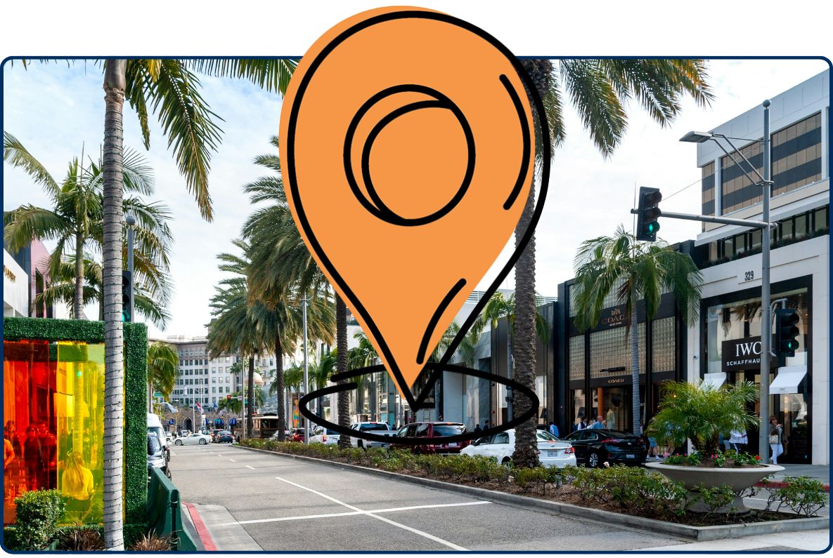 Large location pin icon over a busy street in Beverly Hills, California