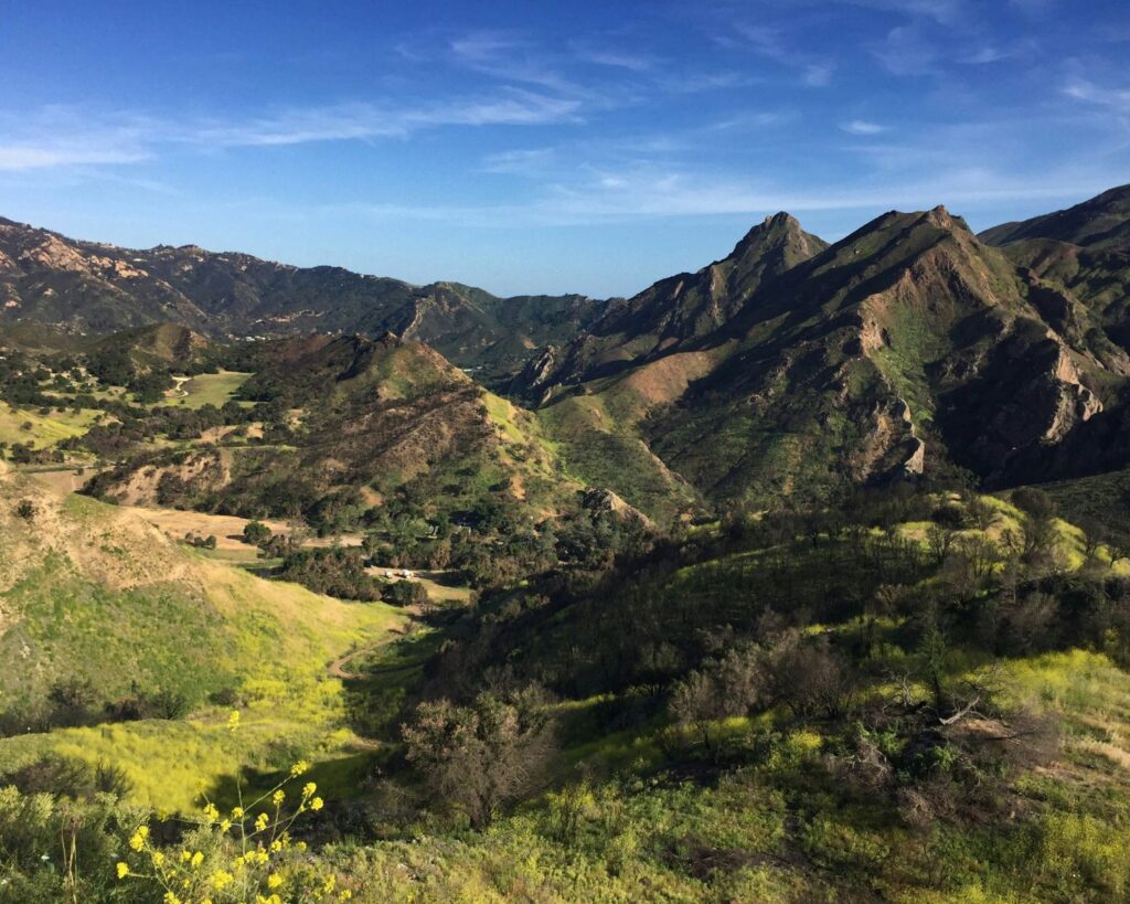 Scenic view of the Santa Monica Mountains near Woodland Hills, California with green hills under a clear blue sky