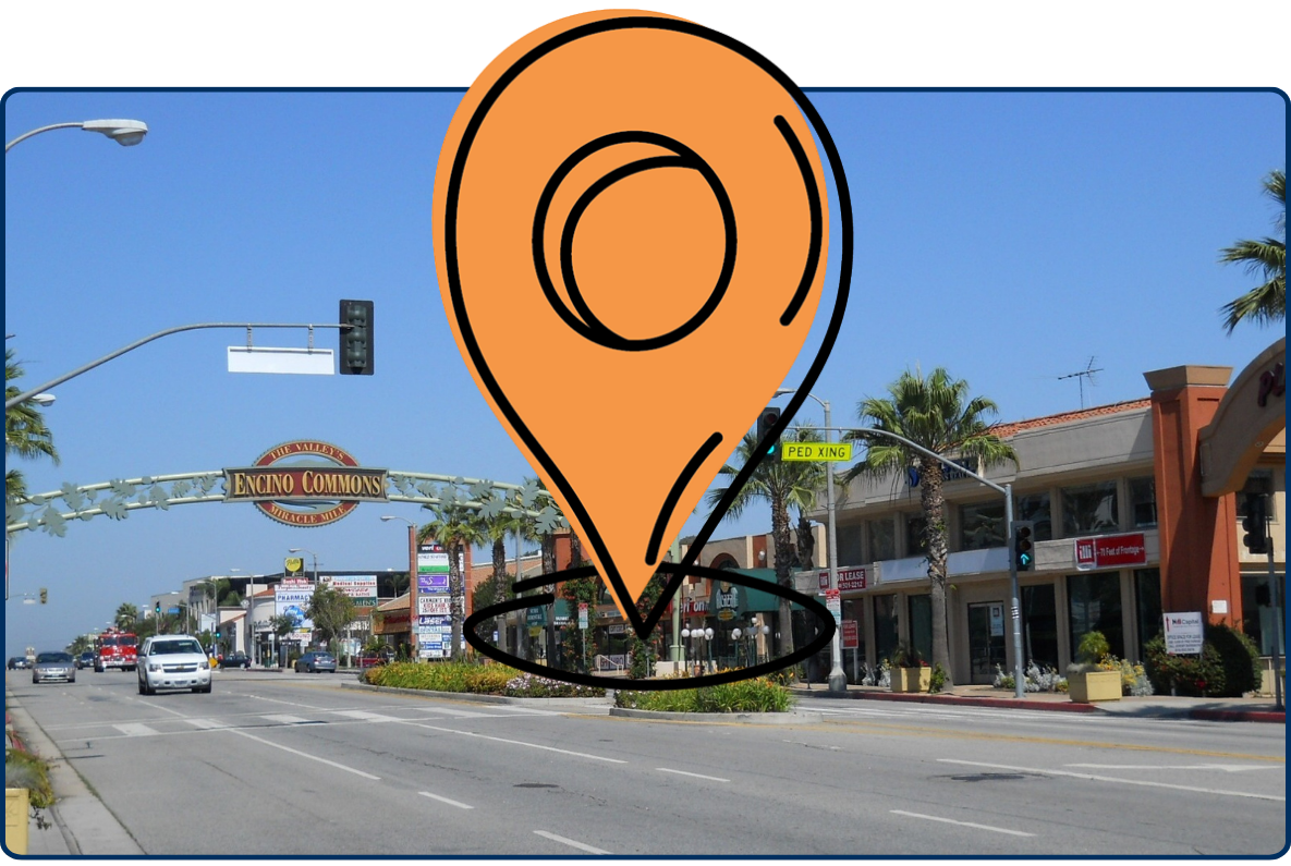 Encino Commons Miracle Mile street view with shopping area, palm trees, and traffic in Encino California
