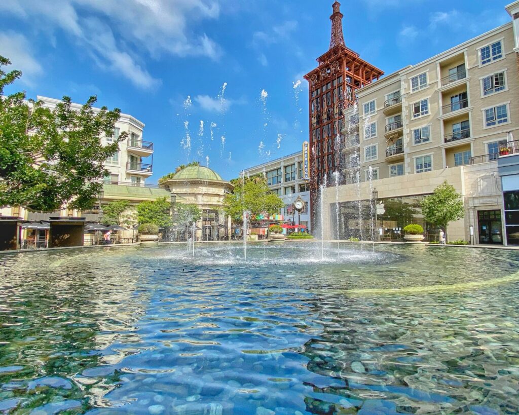 Fountain plaza in downtown Glendale California with modern buildings, water feature, and outdoor urban setting