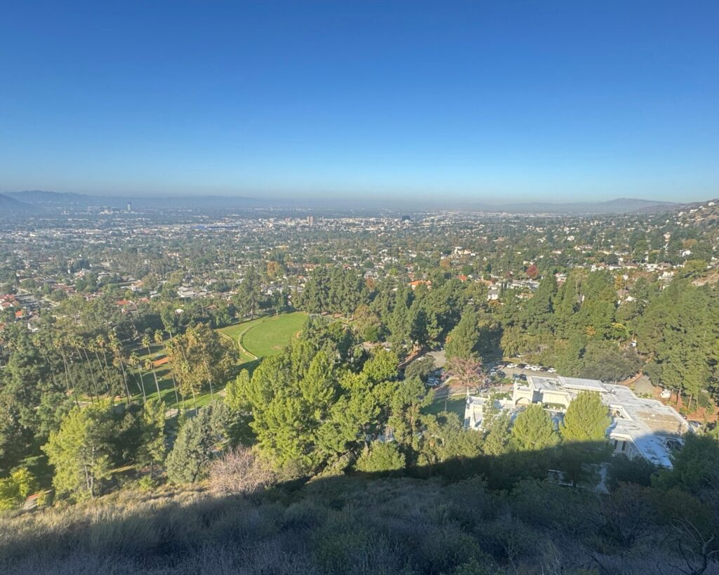 Brand Park Glendale California view from Verdugo Mountains showing green parkland, trees, and cityscape below