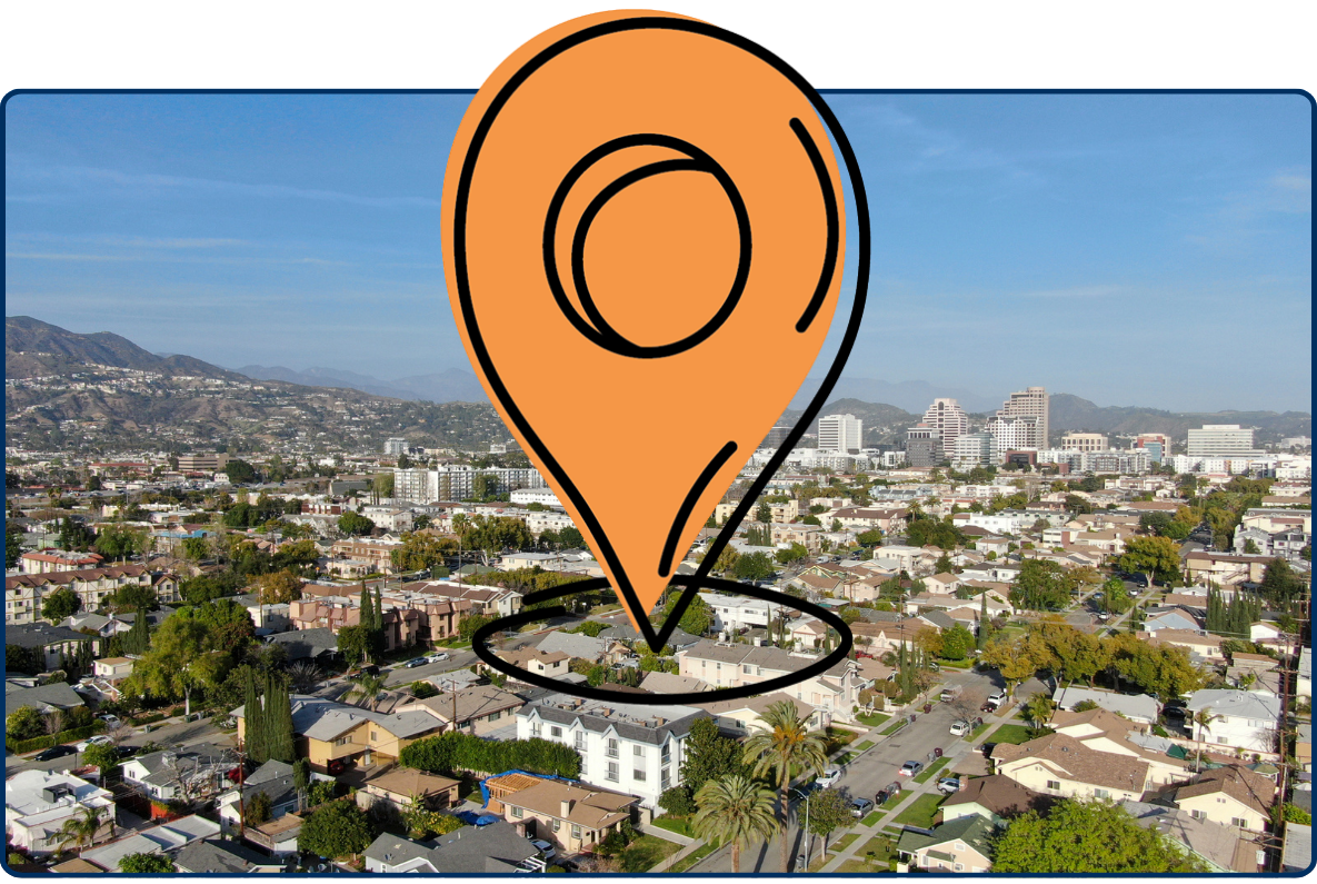 Aerial view of downtown Glendale Los Angeles with residential neighborhoods, city skyline, and mountains in background