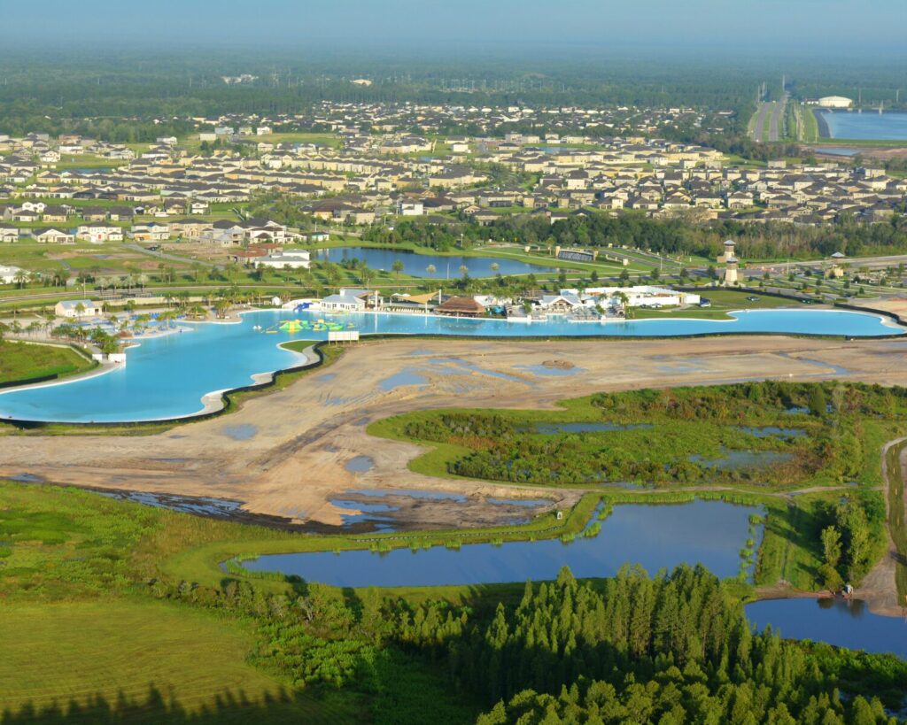 Aerial view of Epperson Lagoon Aquatic Centre in Pasco County Florida with man-made lagoon, surrounding homes, wetlands and recreational development