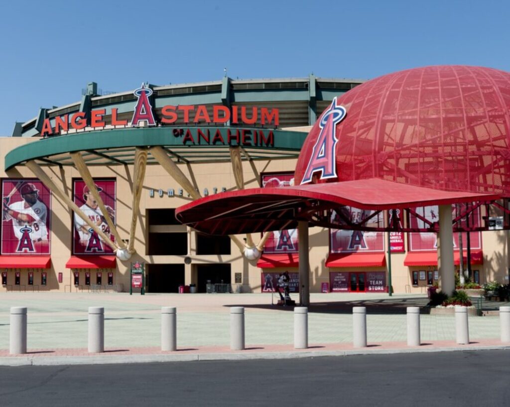 Entrance of Angel Stadium of Anaheim with large red helmet structure and signage, home of the Los Angeles Angels baseball team in California