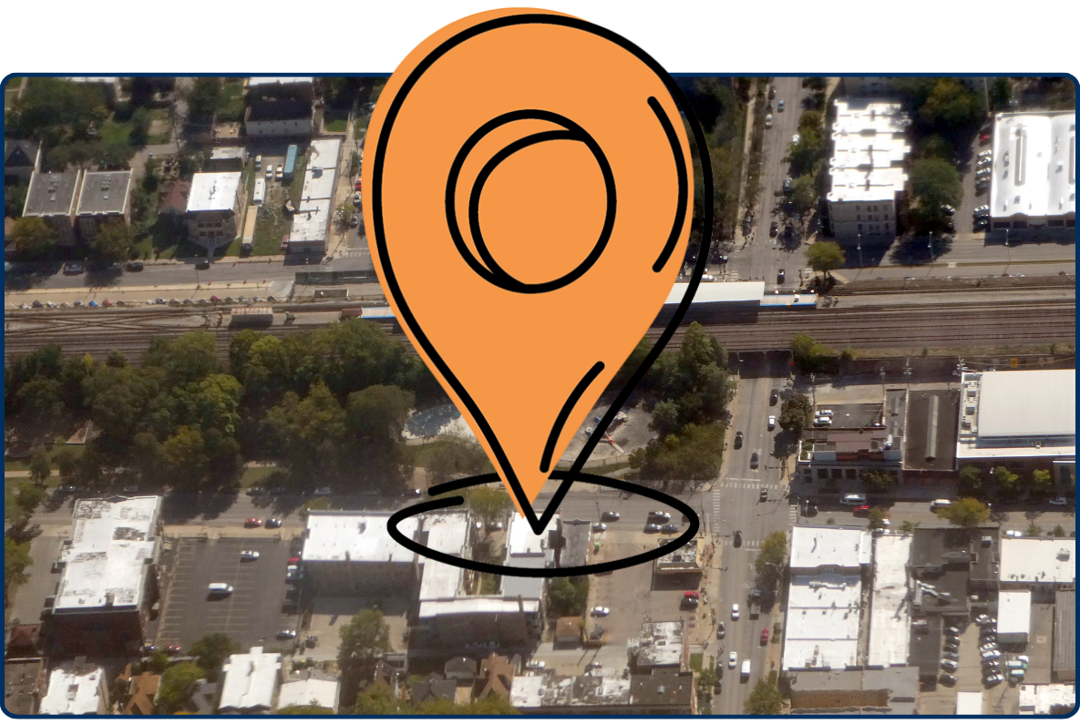 Aerial view of Austin train station with railway tracks buildings streets and urban neighborhood layout
