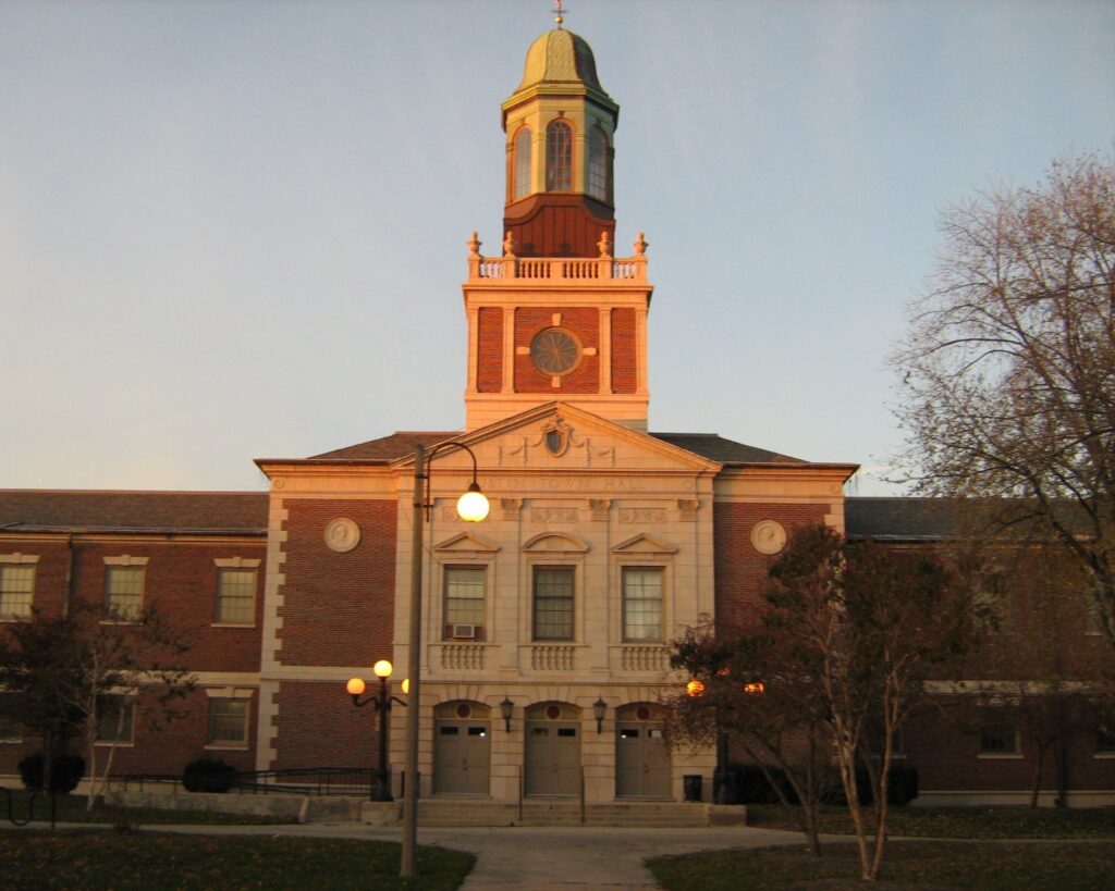 Austin Town Hall historic building with clock tower brick architecture entrance and evening lighting exterior view