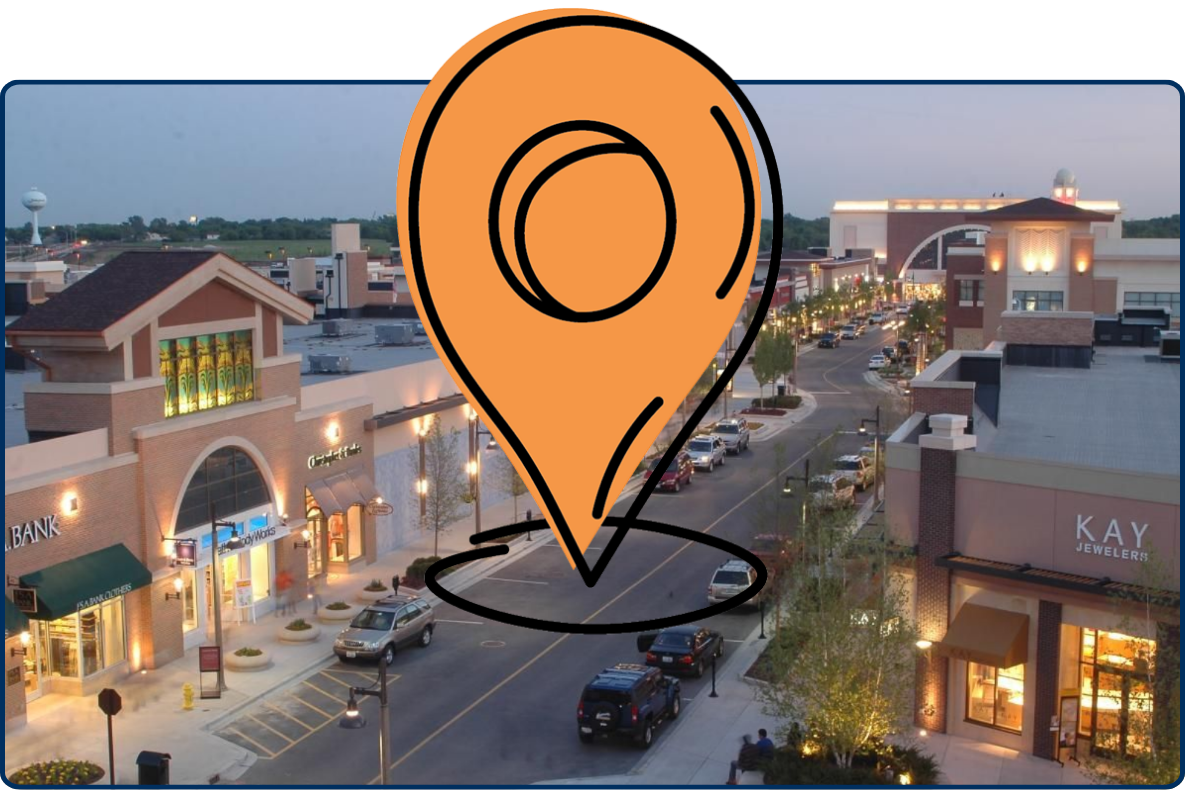 Downtown Bolingbrook Illinois street view with shops buildings evening lights cars road urban commercial area USA