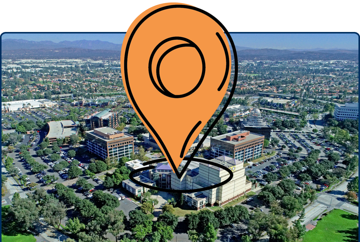 Aerial view of Cerritos Performing Arts Center surrounded by parking areas, trees, and cityscape in Los Angeles County, California
