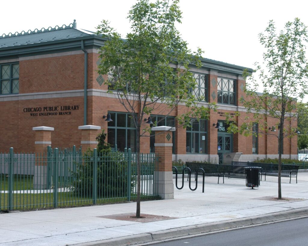 West Englewood Chicago public library building with brick architecture sidewalk trees and urban neighborhood view