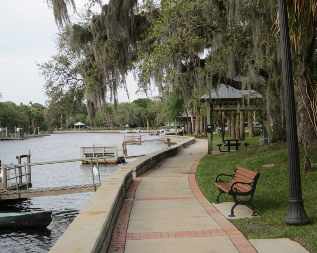 Cotee River Park New Port Richey Florida riverside walkway benches trees water scenic park pathway peaceful outdoor USA
