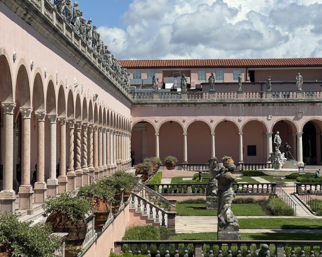 Courtyard of Ringling Museum of Art Sarasota Florida with arches columns sculptures garden historic European style architecture USA