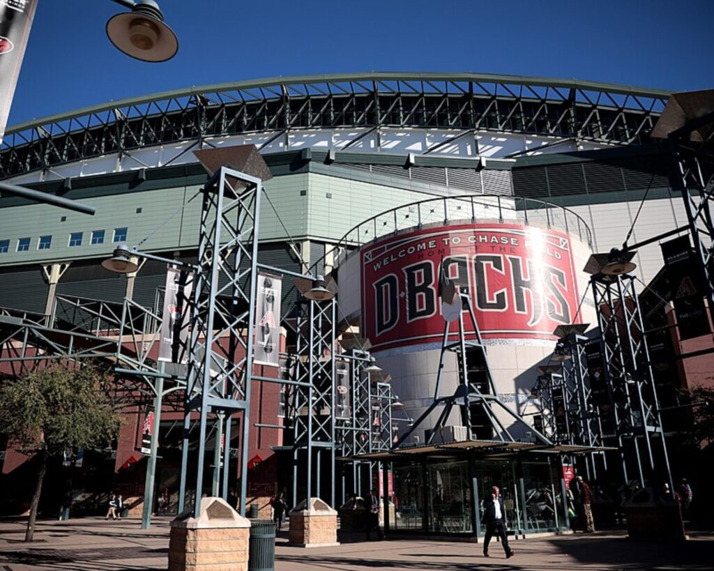 Exterior view of Chase Field baseball stadium in Phoenix, Arizona, featuring the main entrance with structural metal framework and Arizona Diamondbacks signage