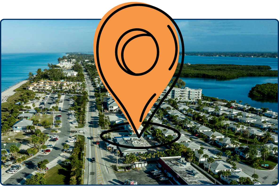 Aerial view of Manasota Key Florida showing beach coastline, residential area, road and ocean on both sides