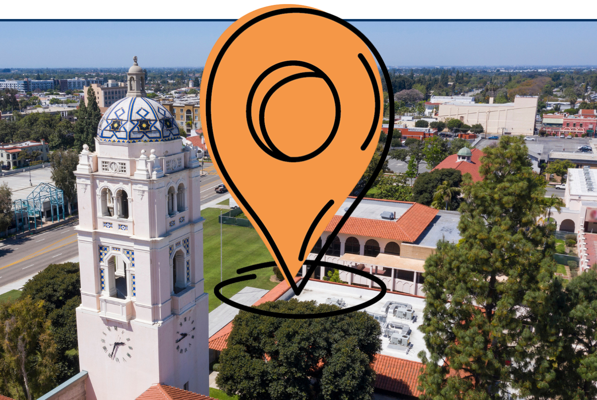 Aerial view of Fullerton, California featuring a historic clock tower with a tiled dome, surrounded by campus buildings and tree-lined streets