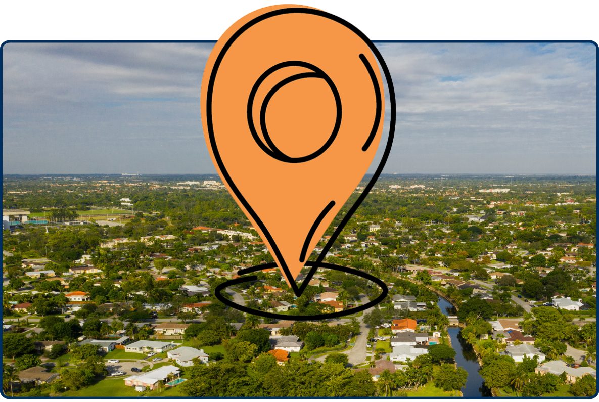 Aerial view of Kendall Miami Florida with residential houses greenery roads and canal under cloudy sky