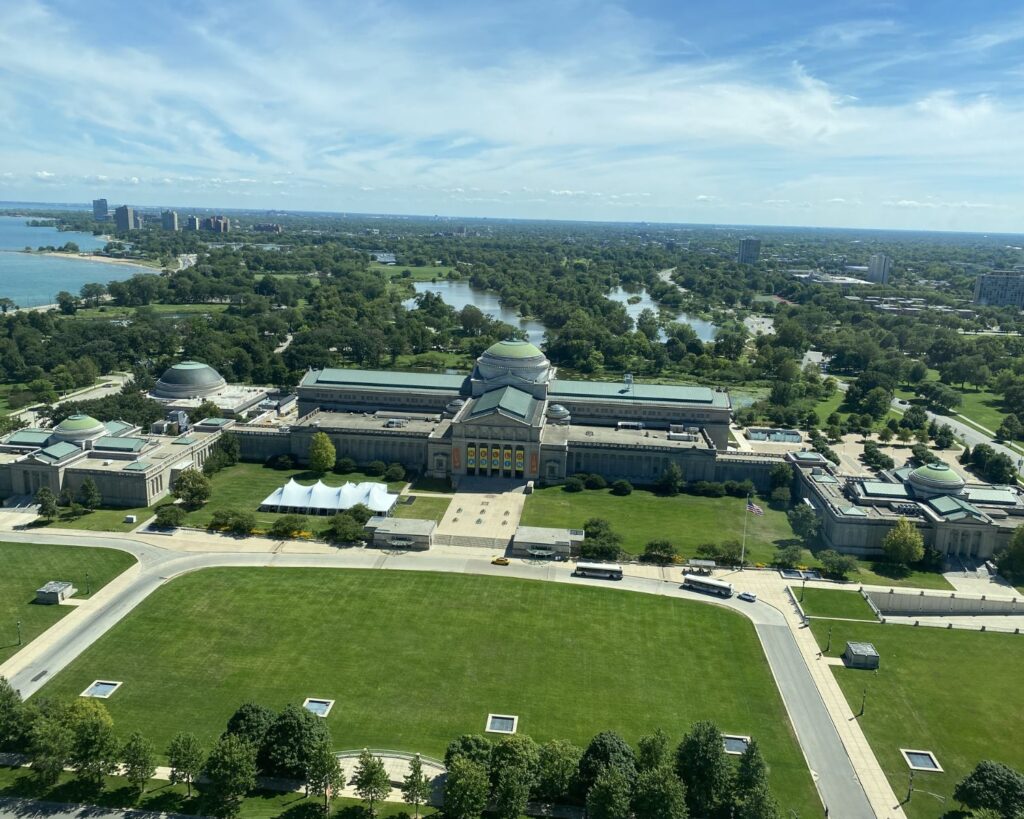 Museum of Science and Industry Chicago aerial view with Jackson Park greenery Lake Michigan nearby and historic building architecture Illinois USA