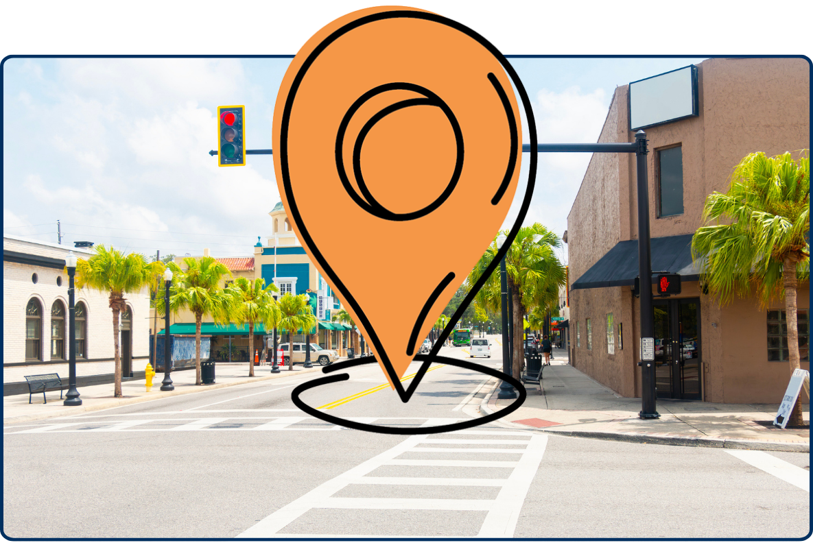 Main Street New Port Richey Florida city street intersection with traffic lights palm trees buildings urban downtown USA