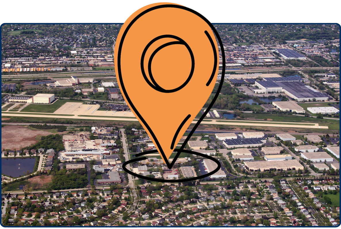 Aerial view of Schaumburg Regional Airport Chicago with runway surrounding residential areas roads and suburban landscape Illinois