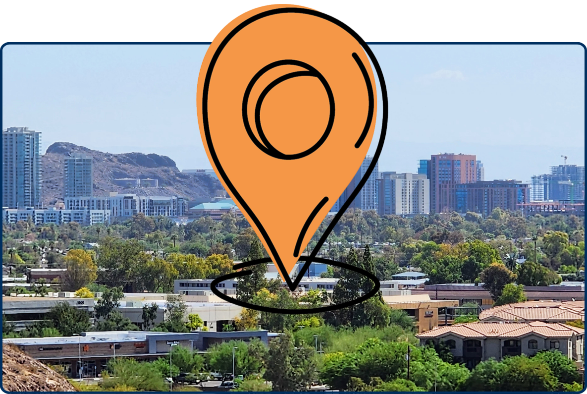 Skyline of Tempe, Arizona featuring modern high-rise buildings, residential areas, and greenery with desert hills in the background under a clear sky