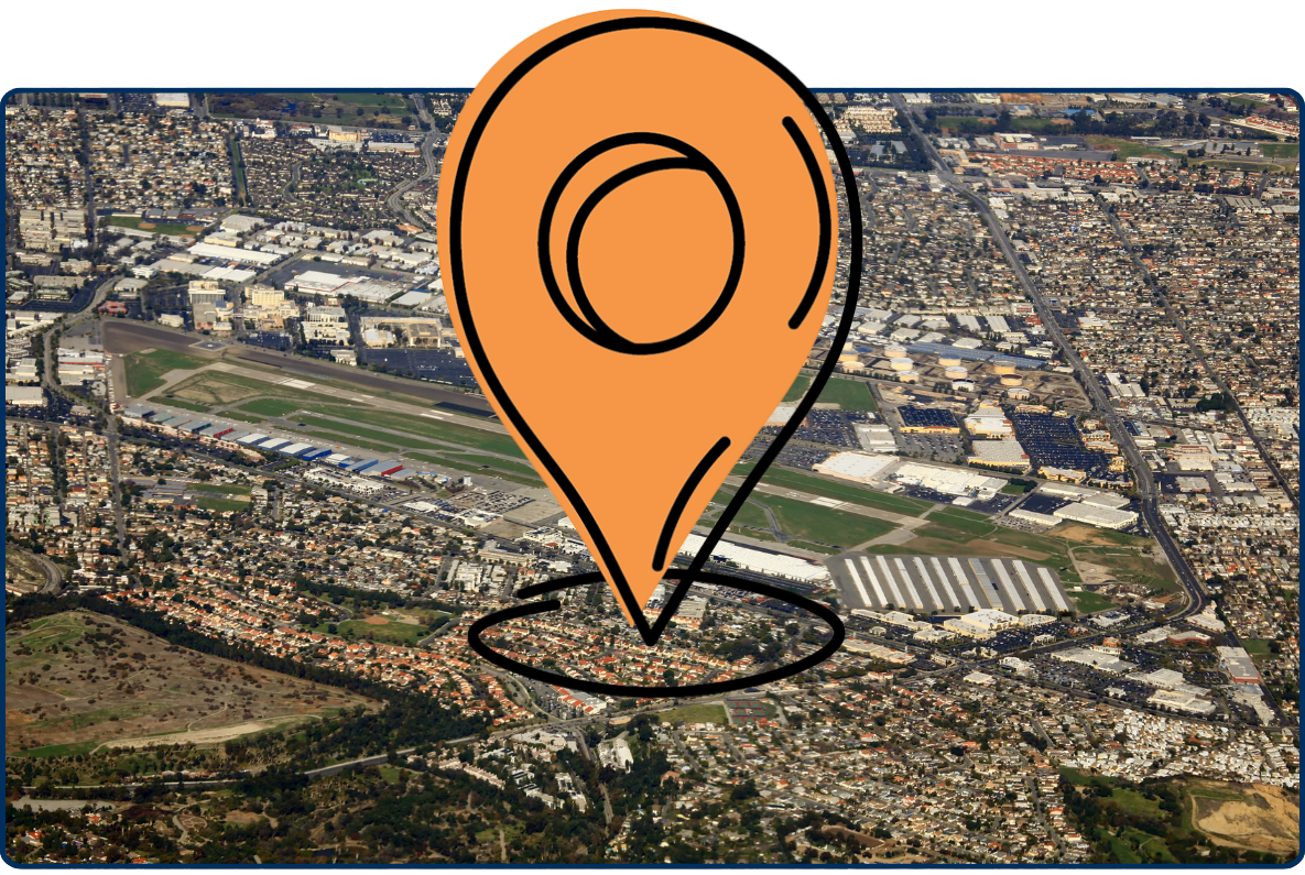 Aerial view of Torrance Zamperini Airfield in Los Angeles, California, showing runways, hangars, and surrounding residential neighborhoods