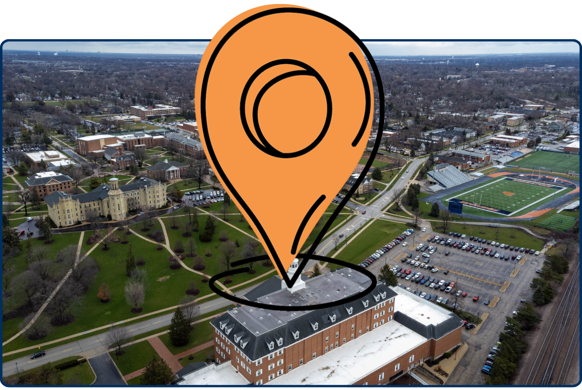 Wheaton College campus Illinois aerial view with academic buildings green lawns roads sports field and surrounding residential area USA