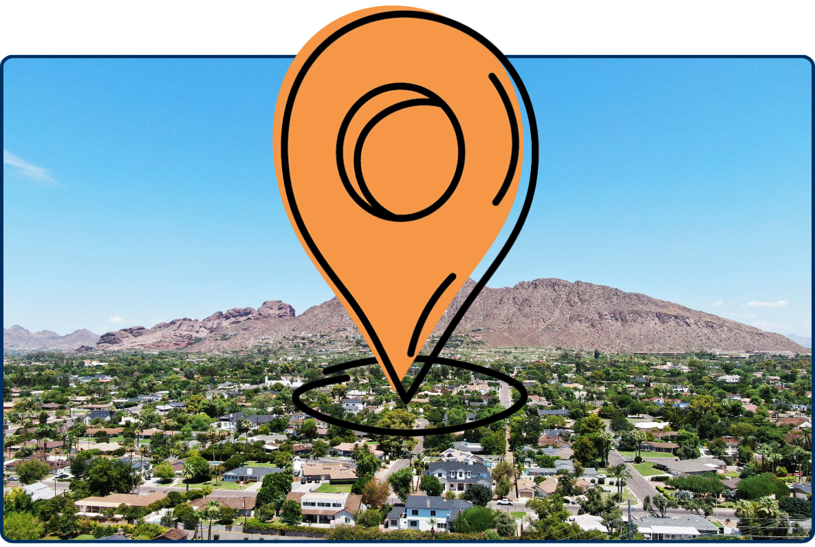 Location pin overlay on a suburban cityscape with mountains in the distance, blue sky above.