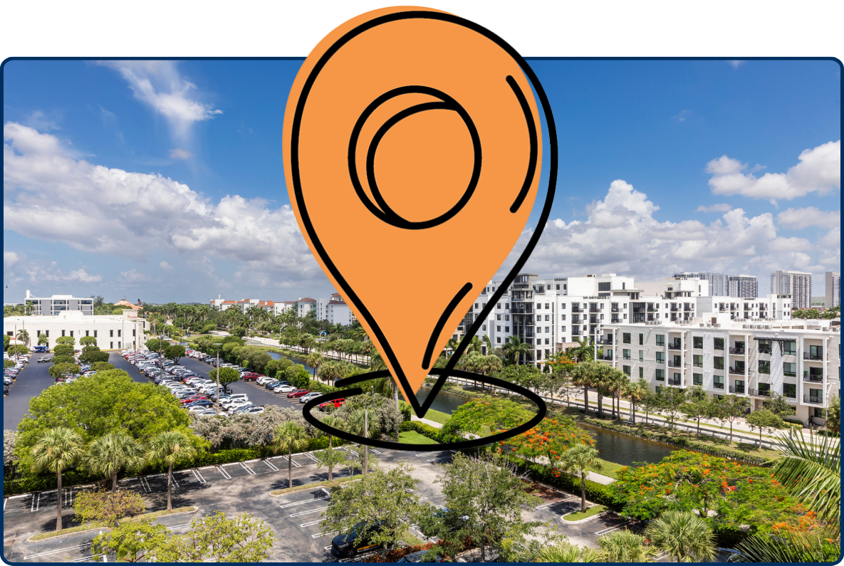 Panoramic view of modern residential buildings, parking lots, palm trees, and a canal in Doral, Florida under a bright blue sky.