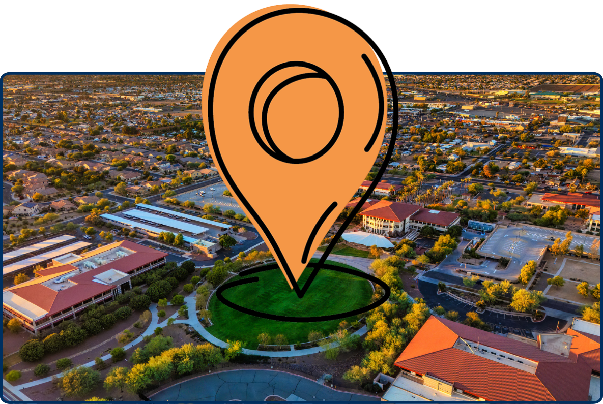 Aerial view of Peoria, Arizona at golden hour with suburban neighborhoods, roads, and a central green park illuminated by warm sunlight.