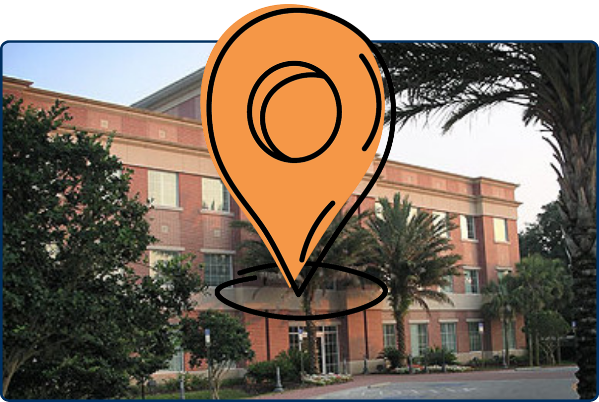 Plant City Hall building in Florida with palm trees lining the entrance and a brick exterior under a clear sky.