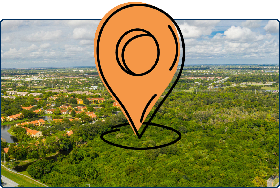 Aerial panorama of Tradewinds Park in Coconut Creek, Florida with dense greenery, roads, and cloudy sky.