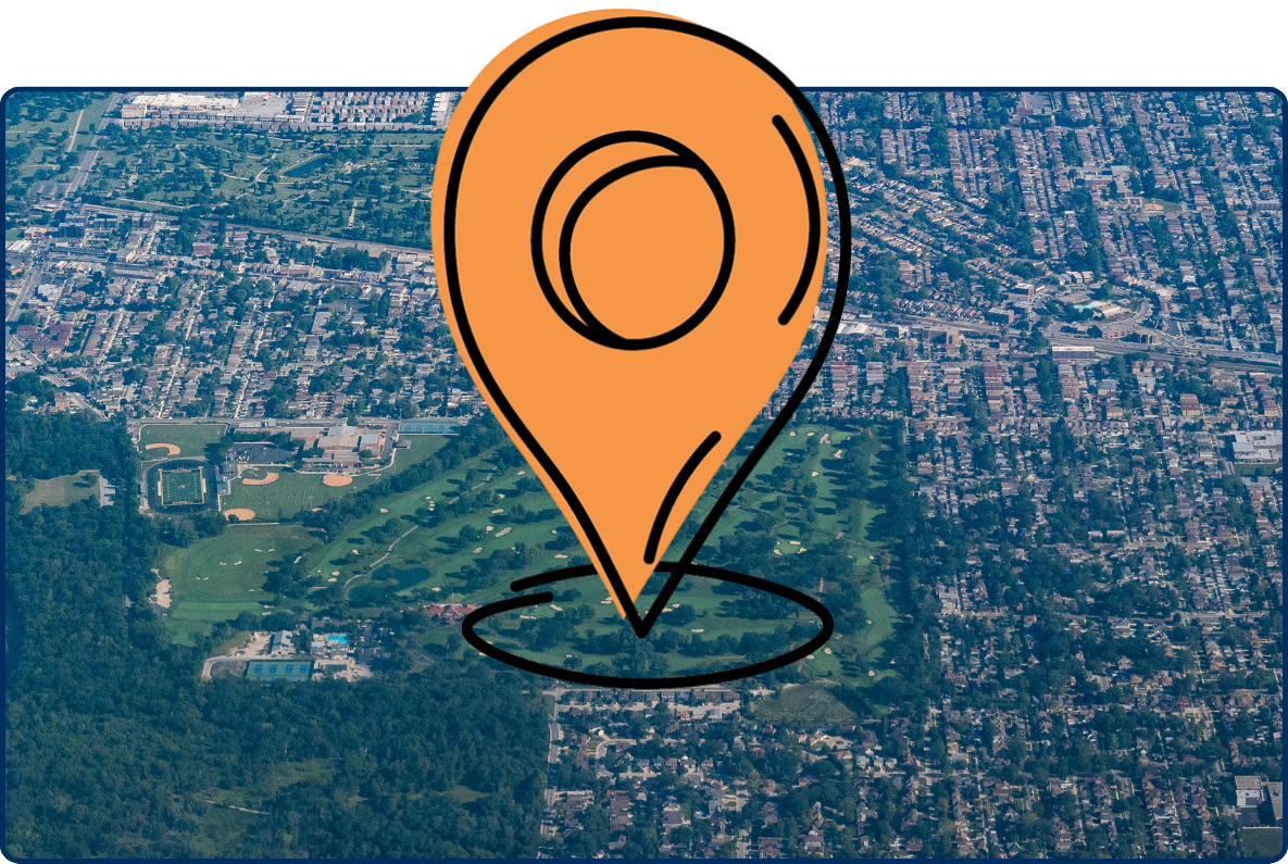 Aerial view of Elmwood Park near Chicago with a golf course, school grounds, forested area, and surrounding neighborhoods.
