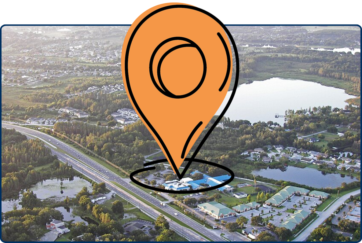 Aerial view of Land O’ Lakes, Florida with roads, lakes, neighborhoods, and green wooded areas.