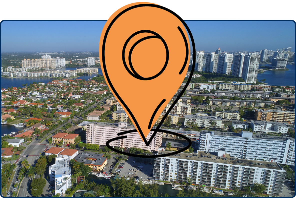 Aerial view of Eastern Shores in North Miami with waterfront homes, canals, high-rise buildings, and blue bay water.