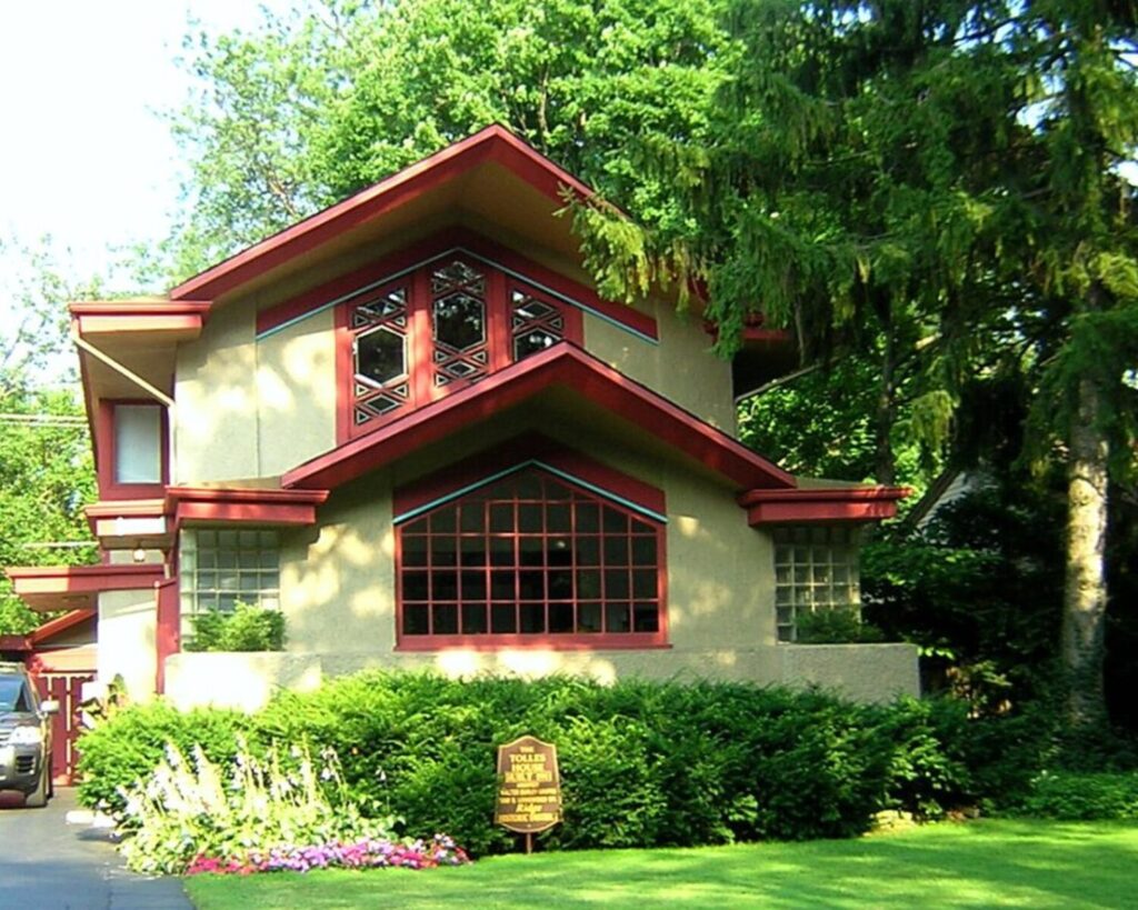 Historic Prairie-style home in the Ridge Historic District, surrounded by lush trees and landscaped gardens.