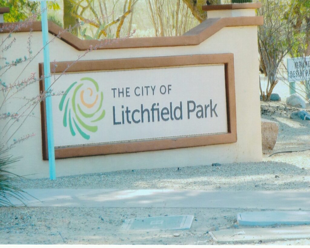 City of Litchfield Park welcome sign surrounded by desert landscaping in Arizona.