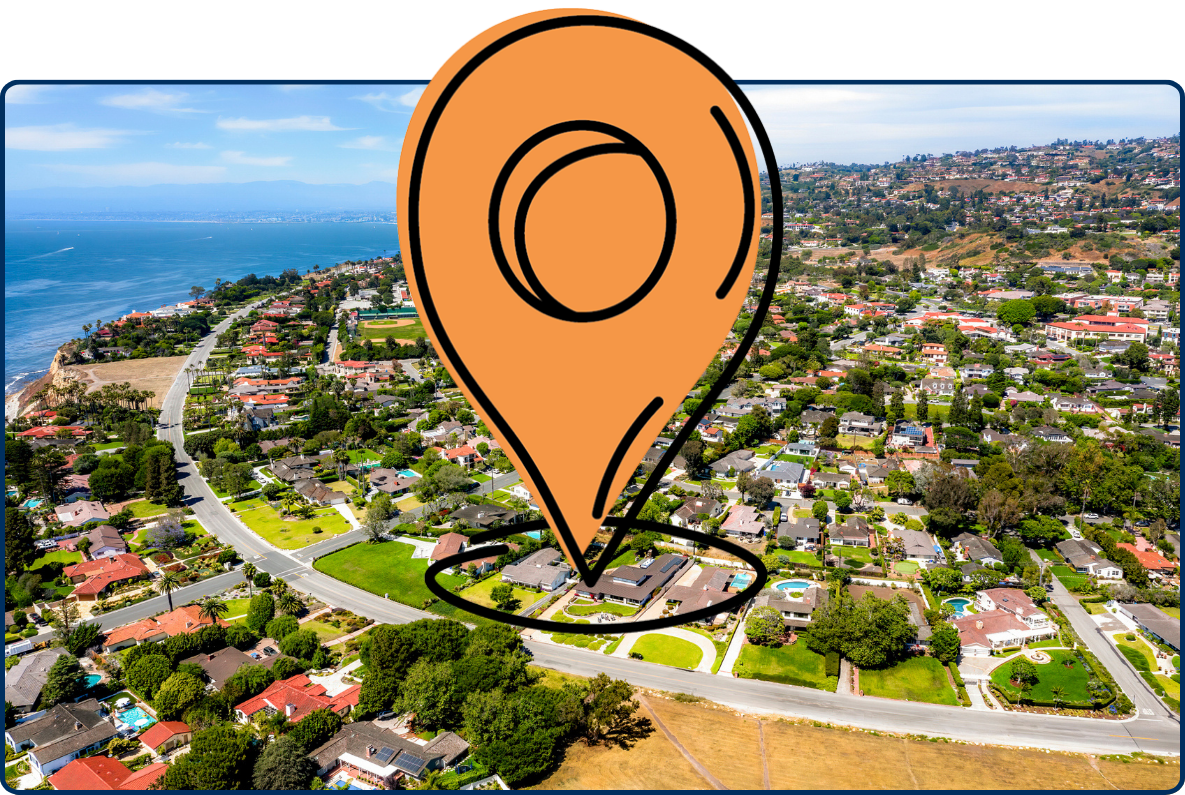 Aerial view of Palos Verdes Estates, California, showing an affluent coastal neighborhood, winding roads, hillside homes, and the Pacific Ocean.