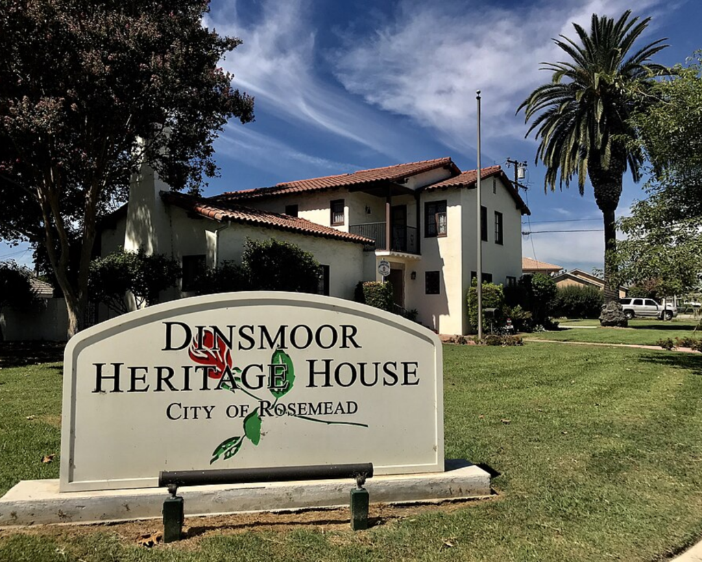 Dinsmoor Heritage House in Rosemead, California, featuring a Spanish-style historic home, palm trees, lawn, and a museum sign.