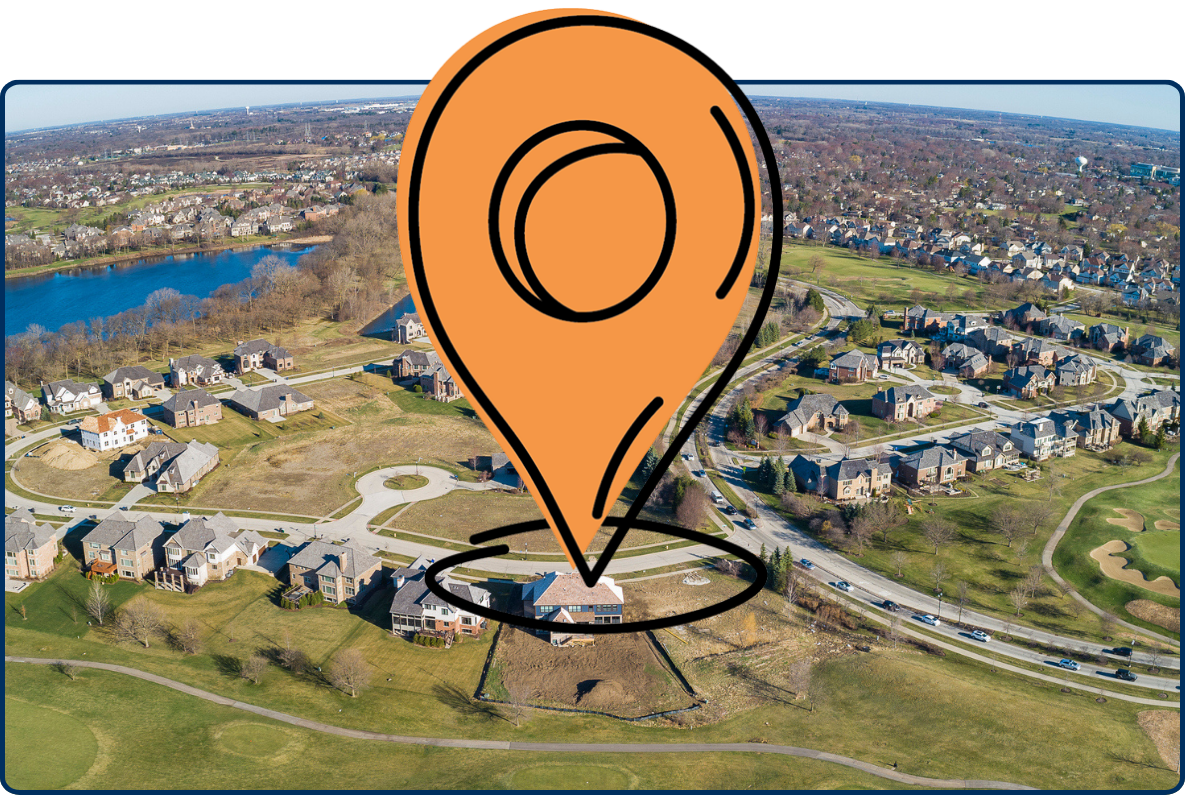Aerial view of a suburban neighborhood with winding roads, houses, ponds, and a golf course.