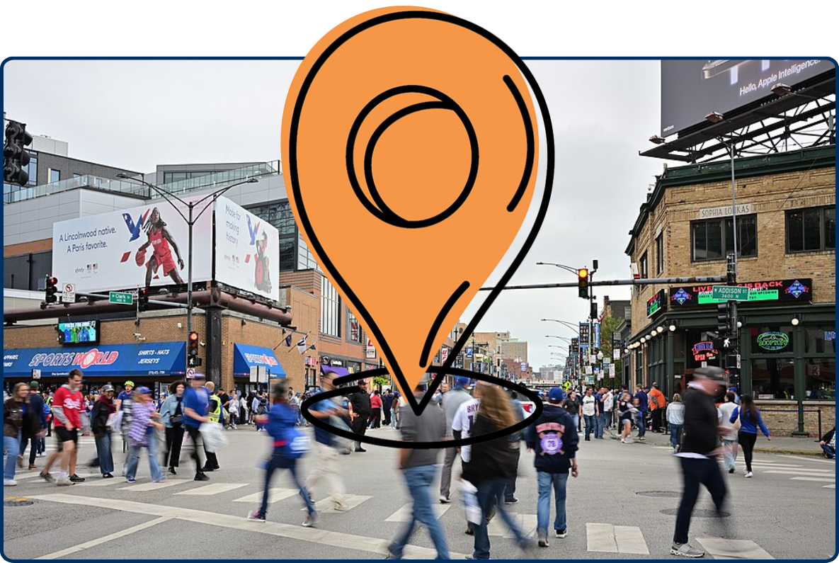 Crowds of baseball fans crossing a busy intersection near Wrigley Field in Chicago before a Cubs game.
