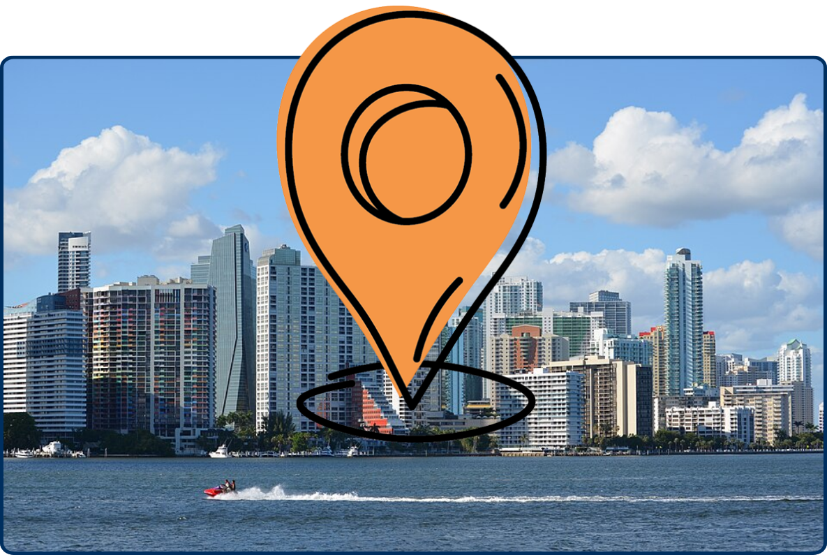 Brickell skyline in Miami, Florida, with modern high-rise buildings along the waterfront and a jet ski crossing the bay.