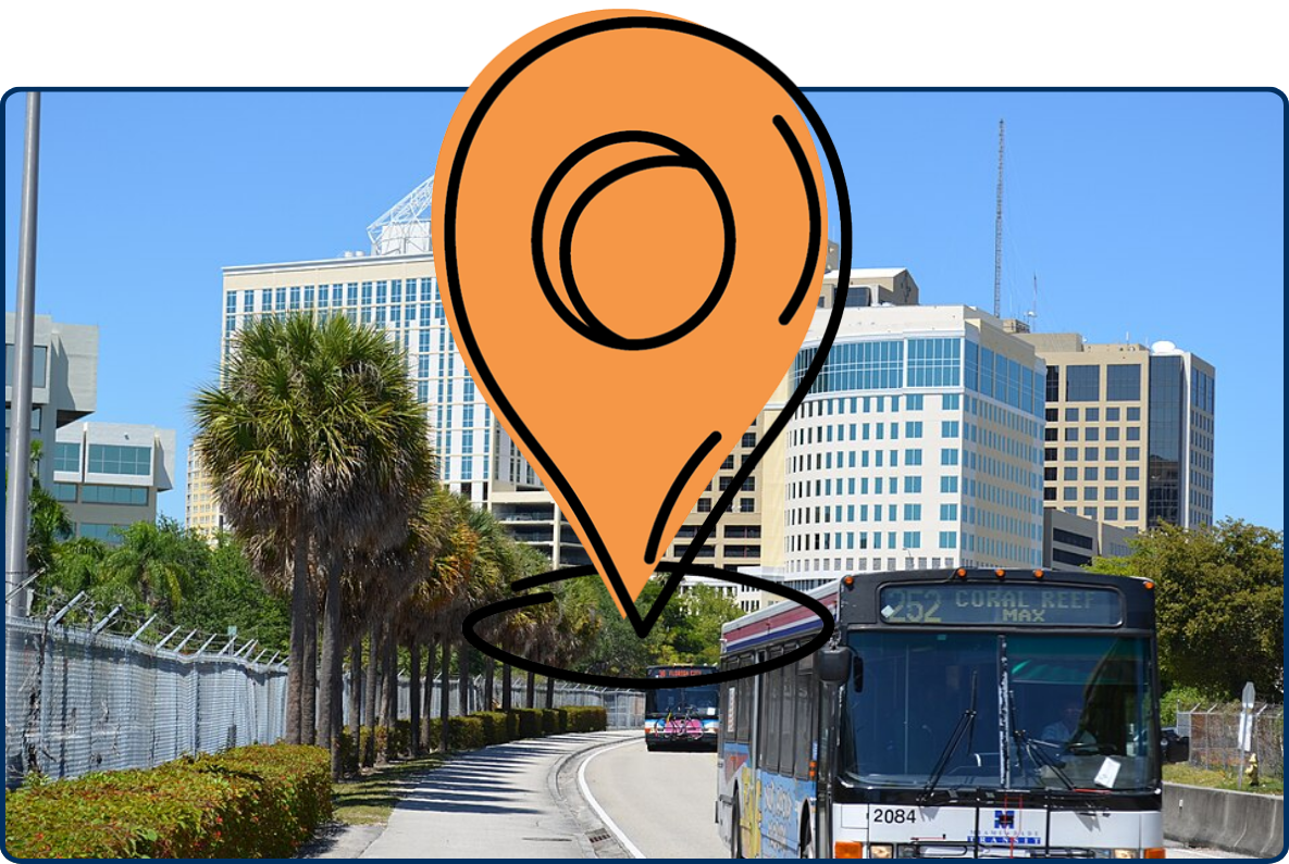 Dadeland in Miami, Florida, with city buses traveling along a palm-lined busway and modern office buildings in the background.