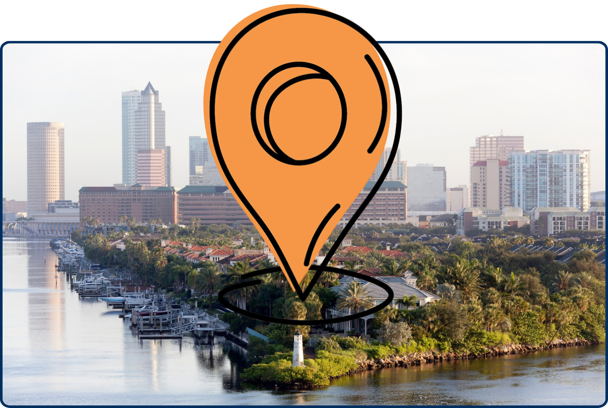Aerial view of Tampa’s Harbour Island, Florida, showing waterfront homes, marinas, palm trees, and the downtown Tampa skyline in the background.