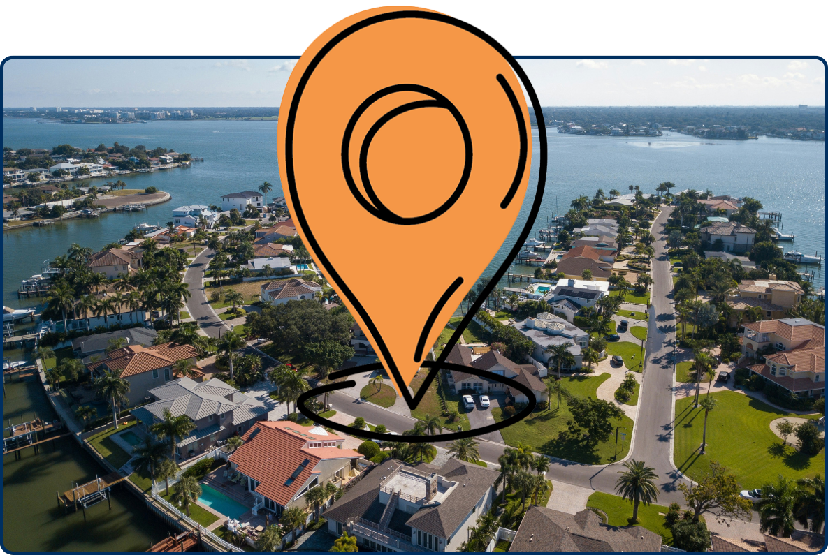 Aerial view of Indian Rocks Beach, Florida, showing waterfront homes, palm-lined streets, private docks, and calm blue waterways.
