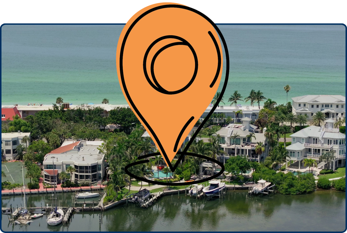 Aerial view of Longboat Key, Florida, showing upscale coastal homes, palm trees, beachfront properties, and the turquoise Gulf of Mexico along the shoreline.
